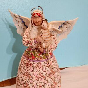 1 of 4 Vintage Jim Shore Agels I have listed. Holding a kitty.